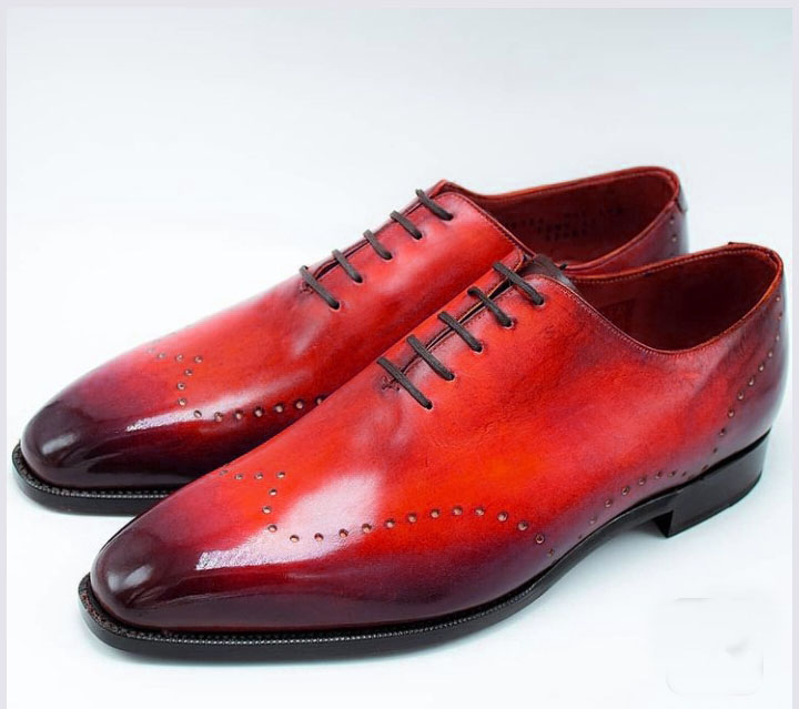black and red wingtip shoes